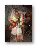my friend Randy Fabres with one of his guitars: My photo with Photoshop intervention. Randy died 8/18/05...he left a hole in my life and the lives of many.