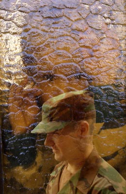 background shows my son Peter as a small boy looking through a decorative glass panel, foreground as he is now. A Photoshop intervention. ©2003-C.E.Newland - Digital Image-Pfc. Peter Newland